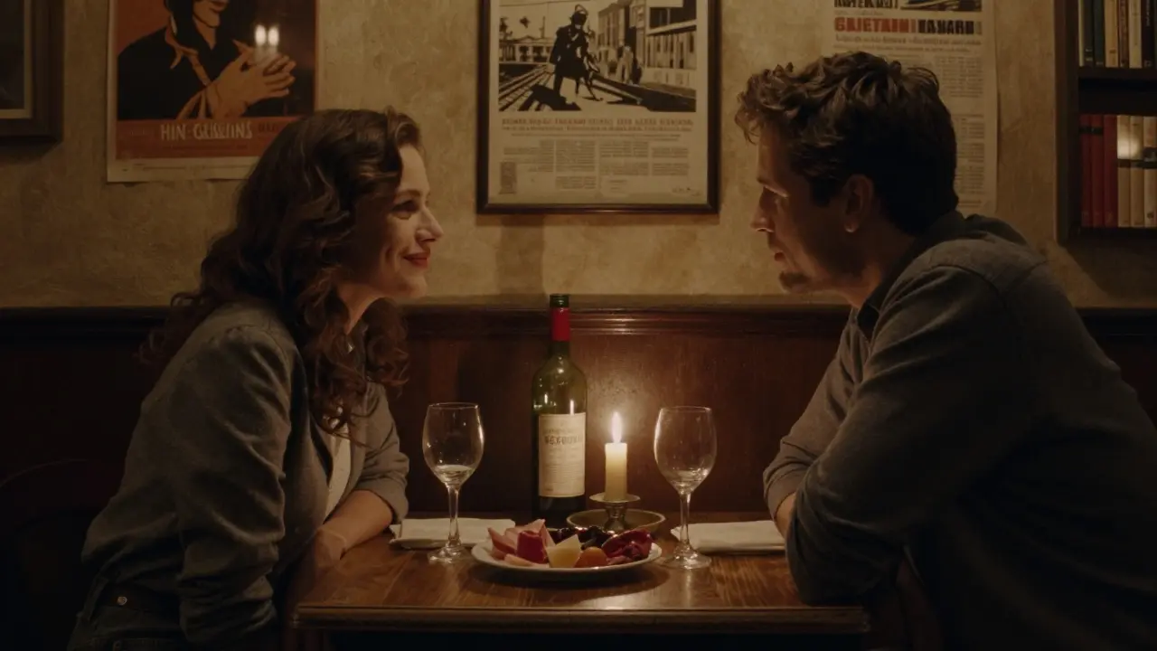 Intimate dinner at a Parisian bistro, candlelight on a wooden table with wine and charcuterie.