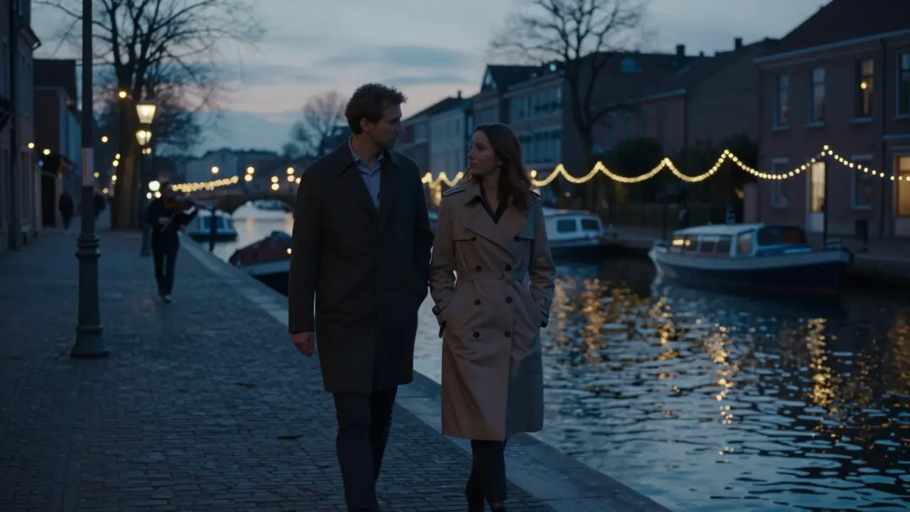Two people walking peacefully along the Navigli canal under string lights at twilight.