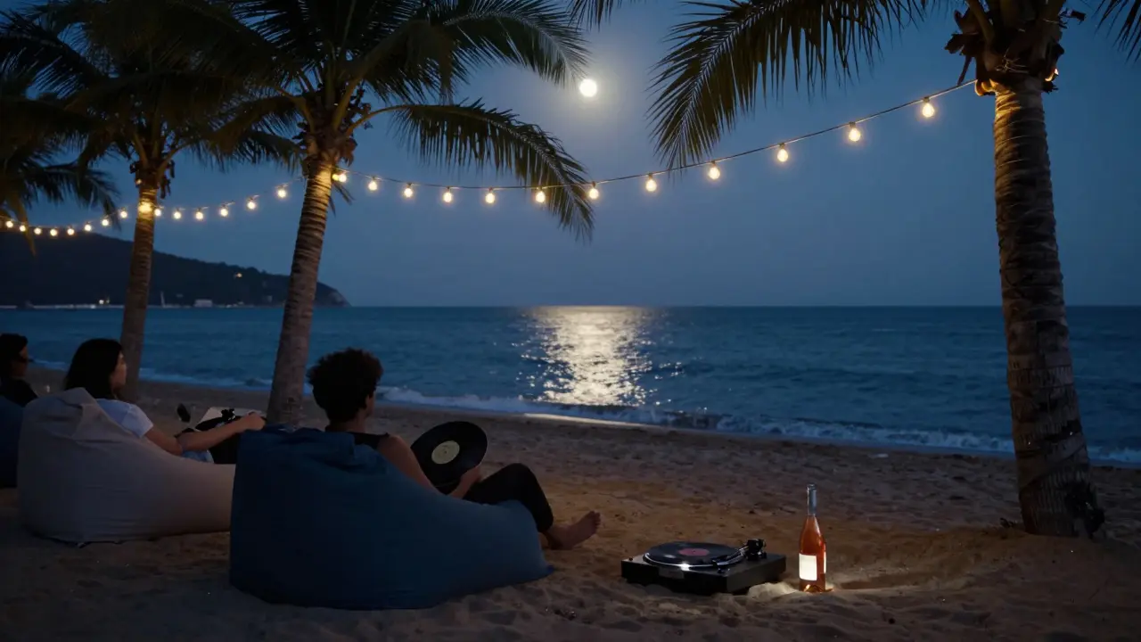 Barefoot guests relaxing on bean bags by the sea under string lanterns at a midnight beach bar.