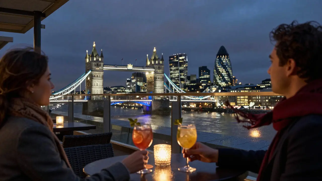 Two people enjoy cocktails on a rooftop lounge with London’s skyline glowing behind them.