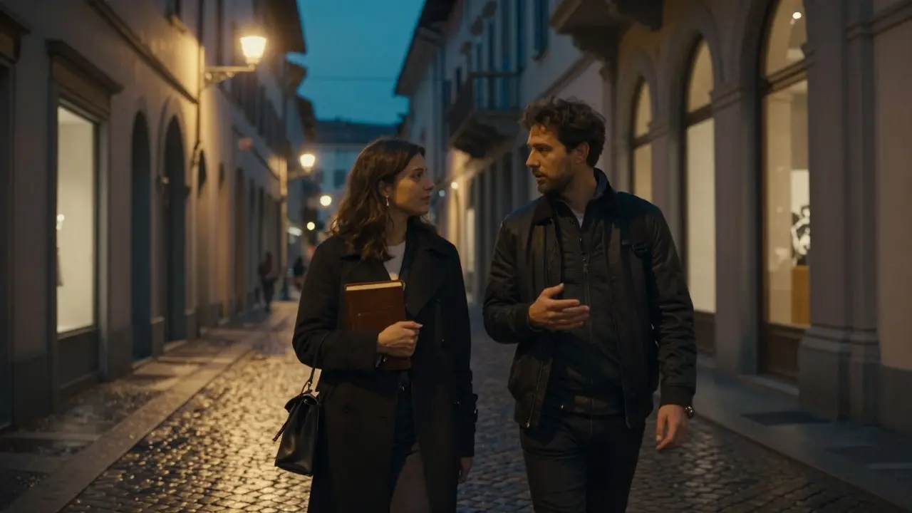 A man and woman walk peacefully through Milan's Brera district at night, engaged in thoughtful conversation.