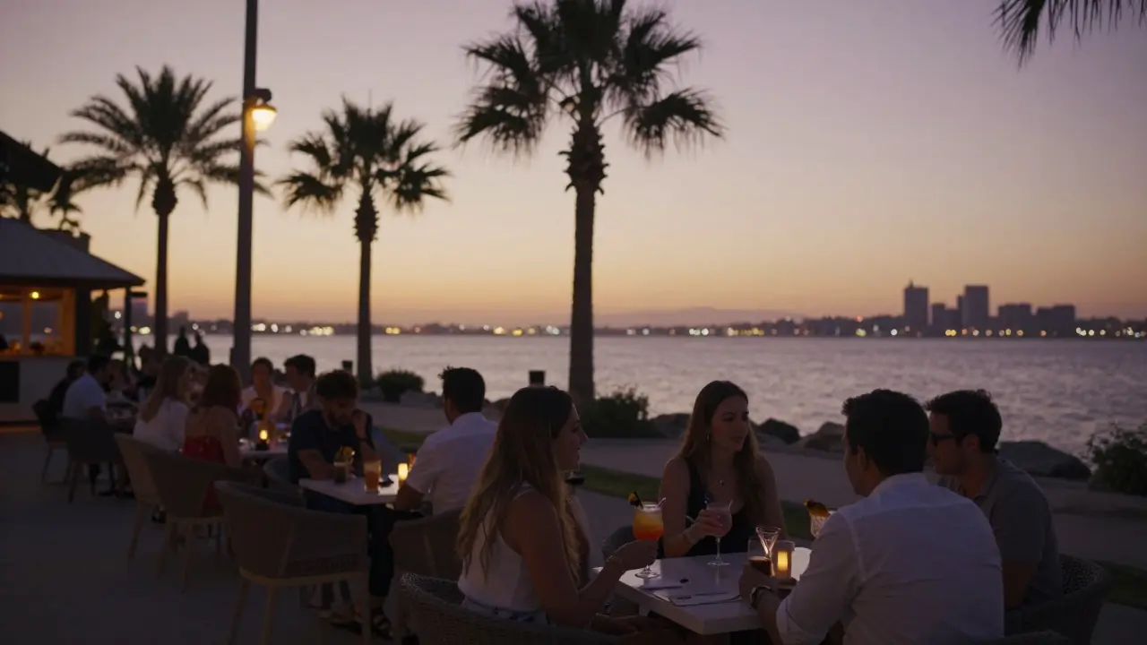 Sunset waterfront lounge with couples enjoying drinks by the coast